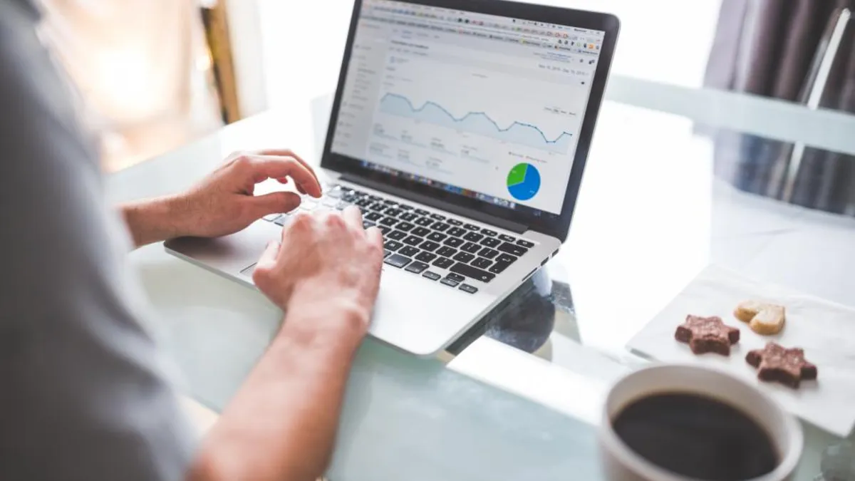 A laptop showing a marketing analytics dashboard